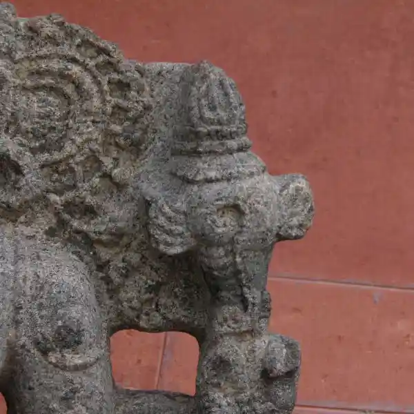 Statue of an Indian god, winged crosier symbol